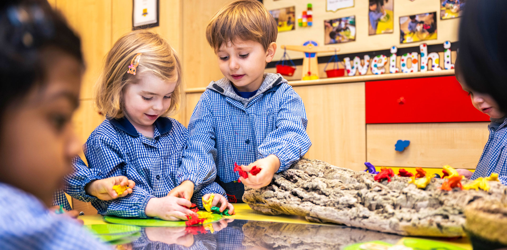 Early years students learning in class at BJAB