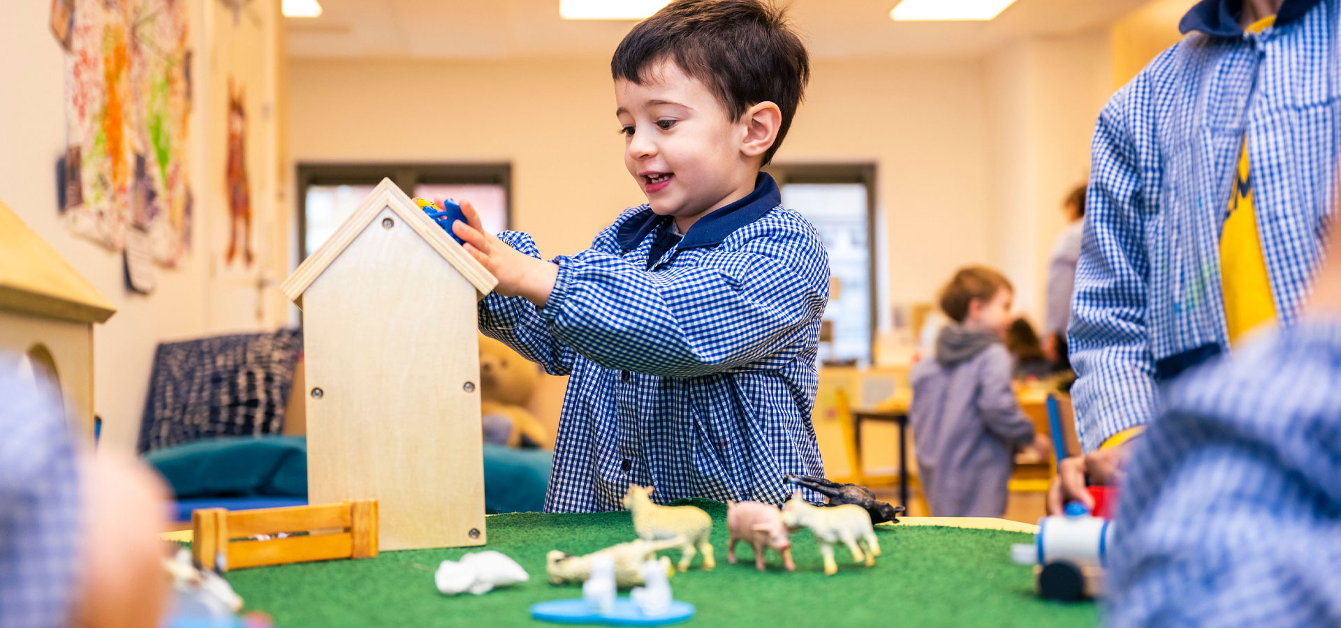 Early years students learning in class at BJAB